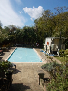 Pool with Victorian bathing shed on right hand side. Lovely, sunny day